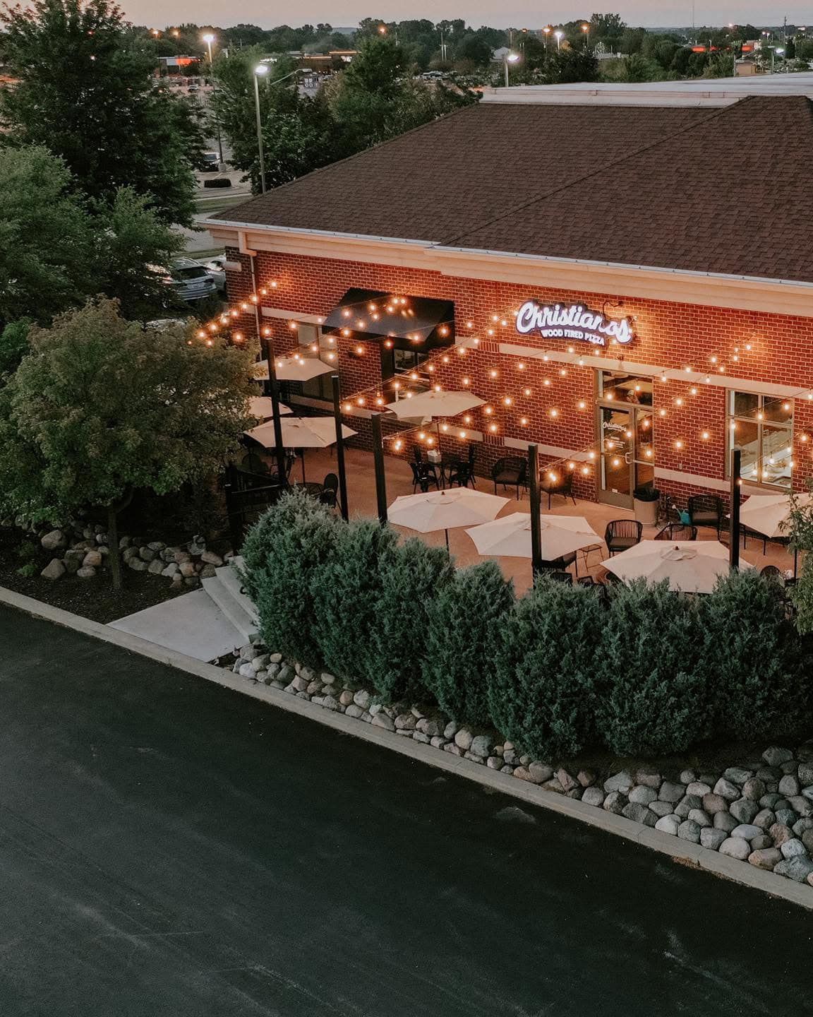 An aerial view of a restaurant with tables and umbrellas