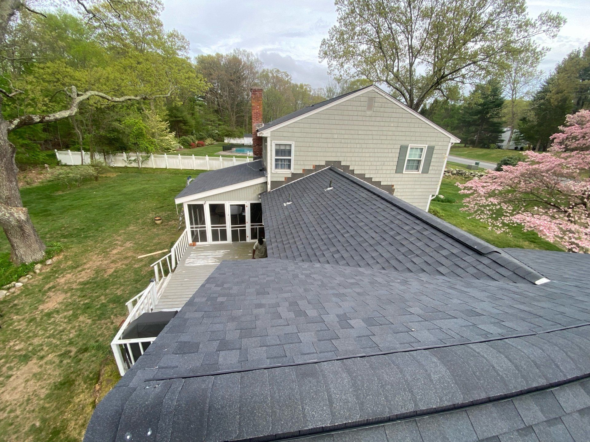top view of cream house with bluish gray roof