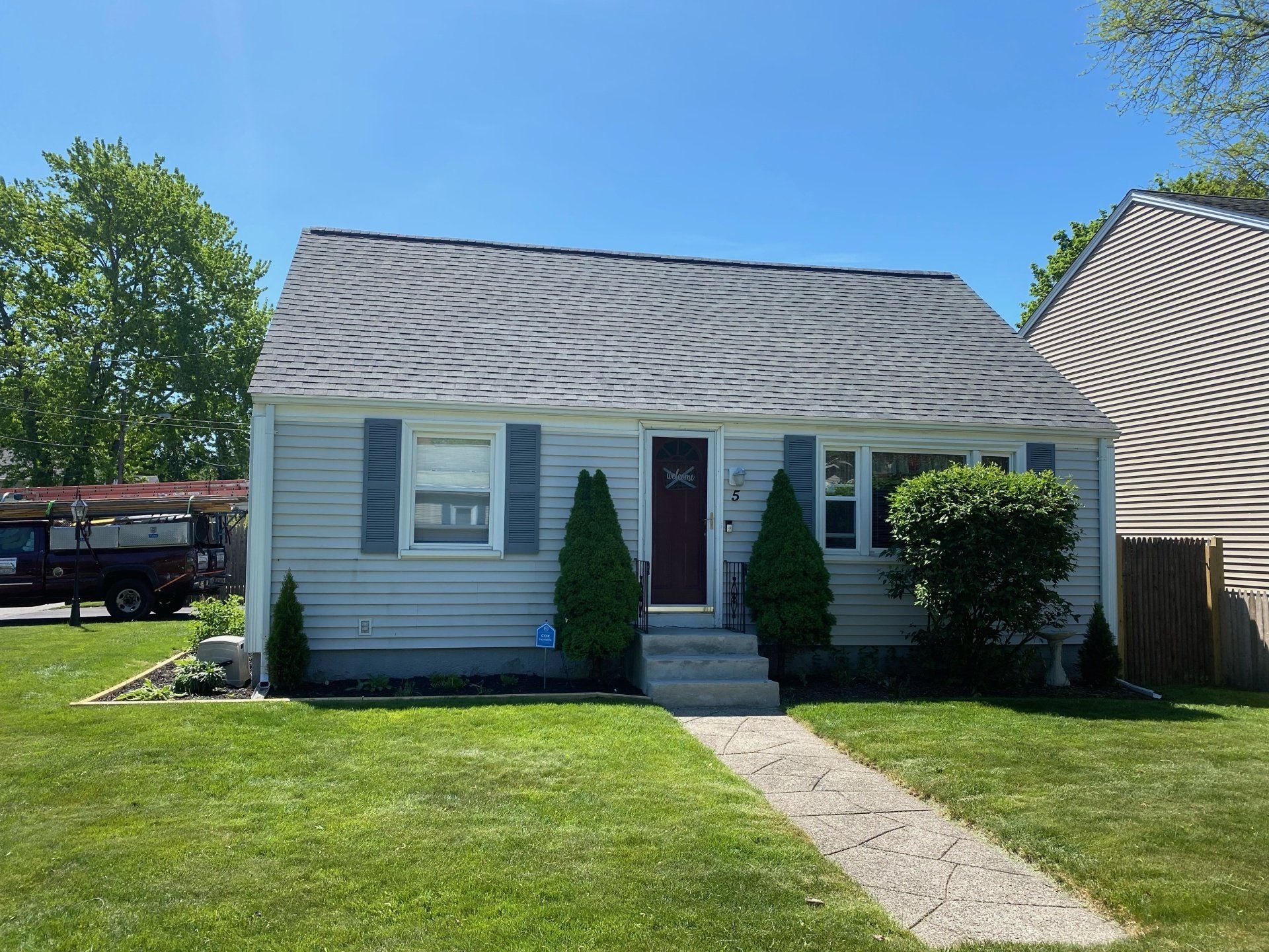 small blue house with gray roof