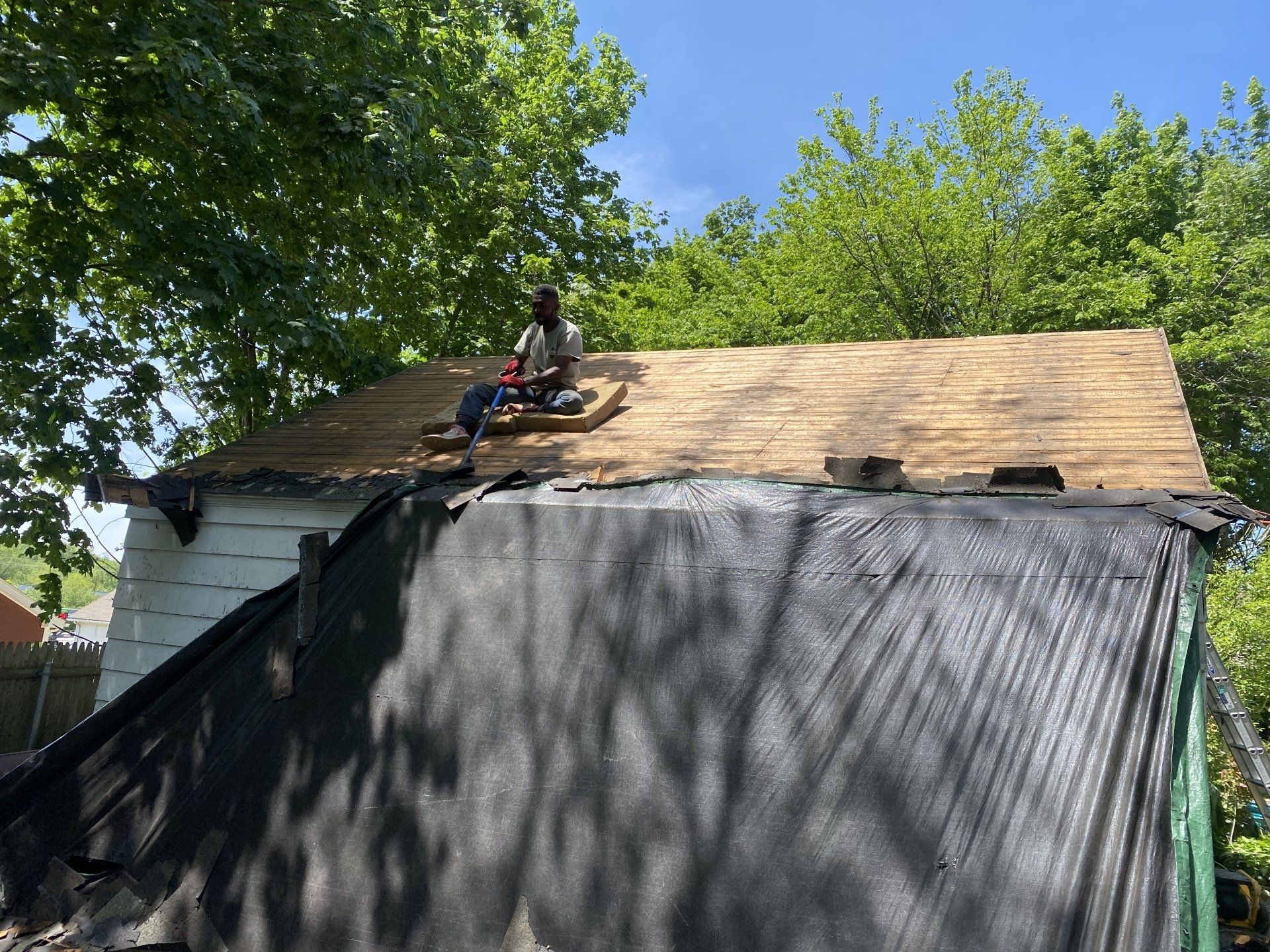 man working on roof
