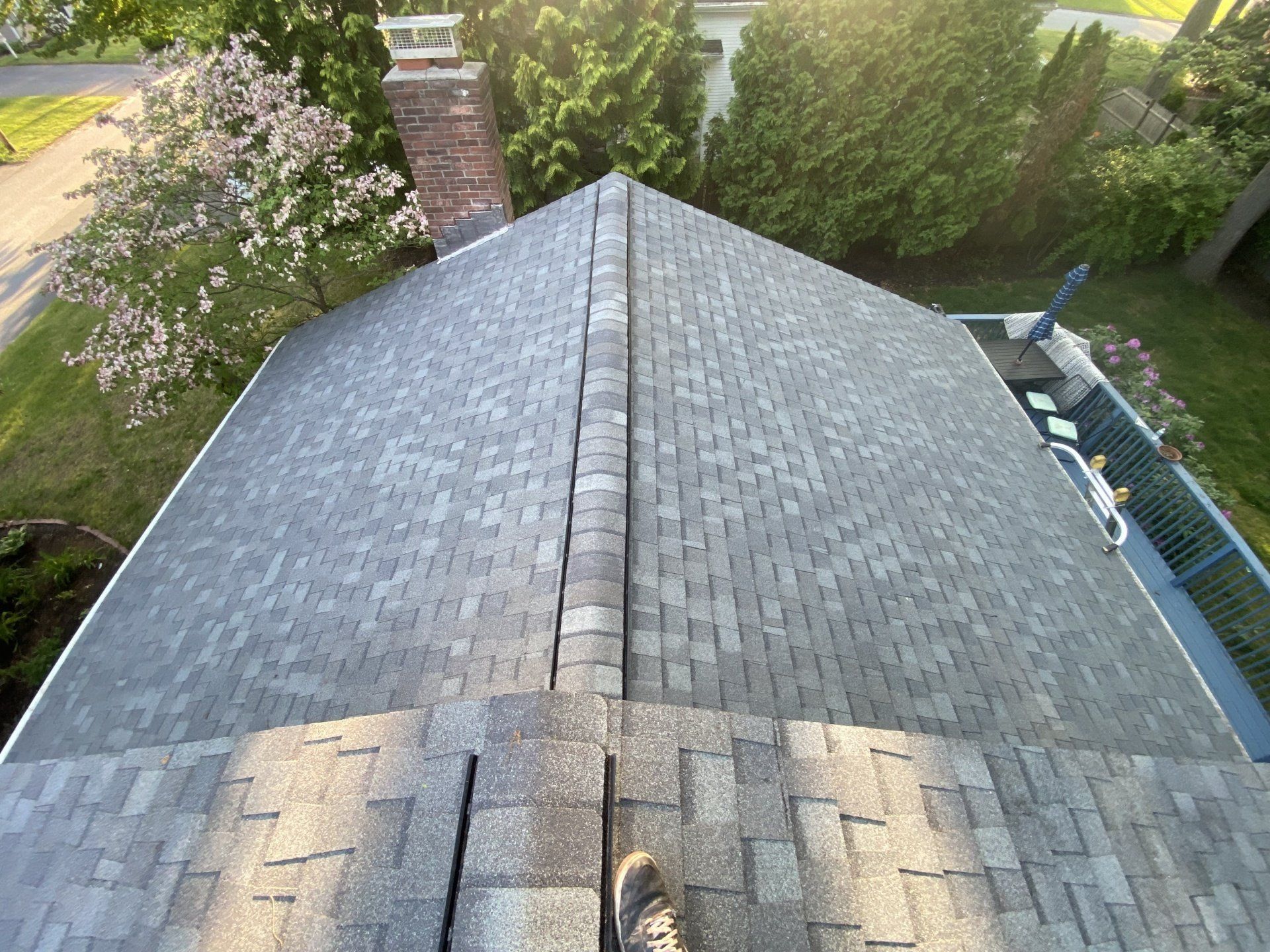 gray roof with red brick chimney