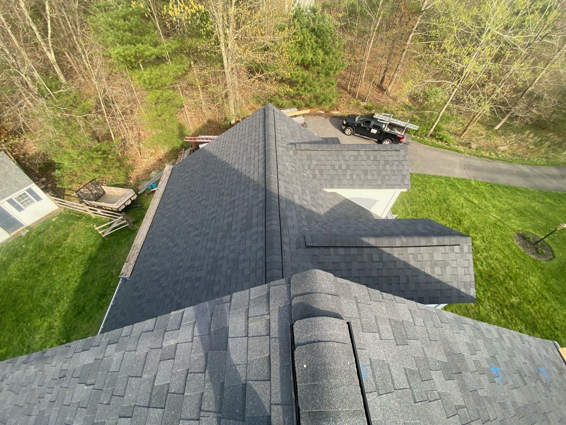 top view of bluish gray roof with parked car