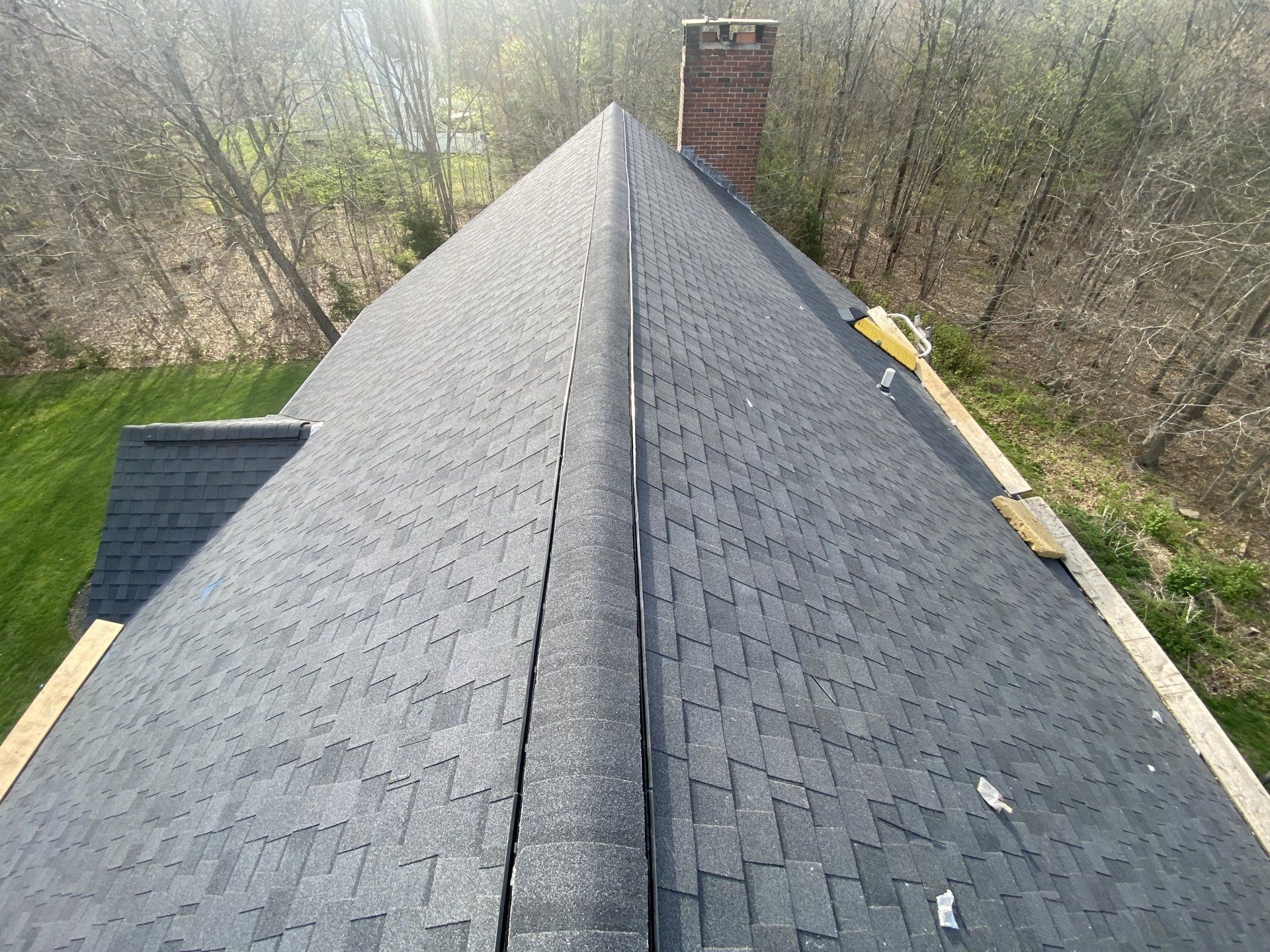 top view of bluish gray roof with chimney
