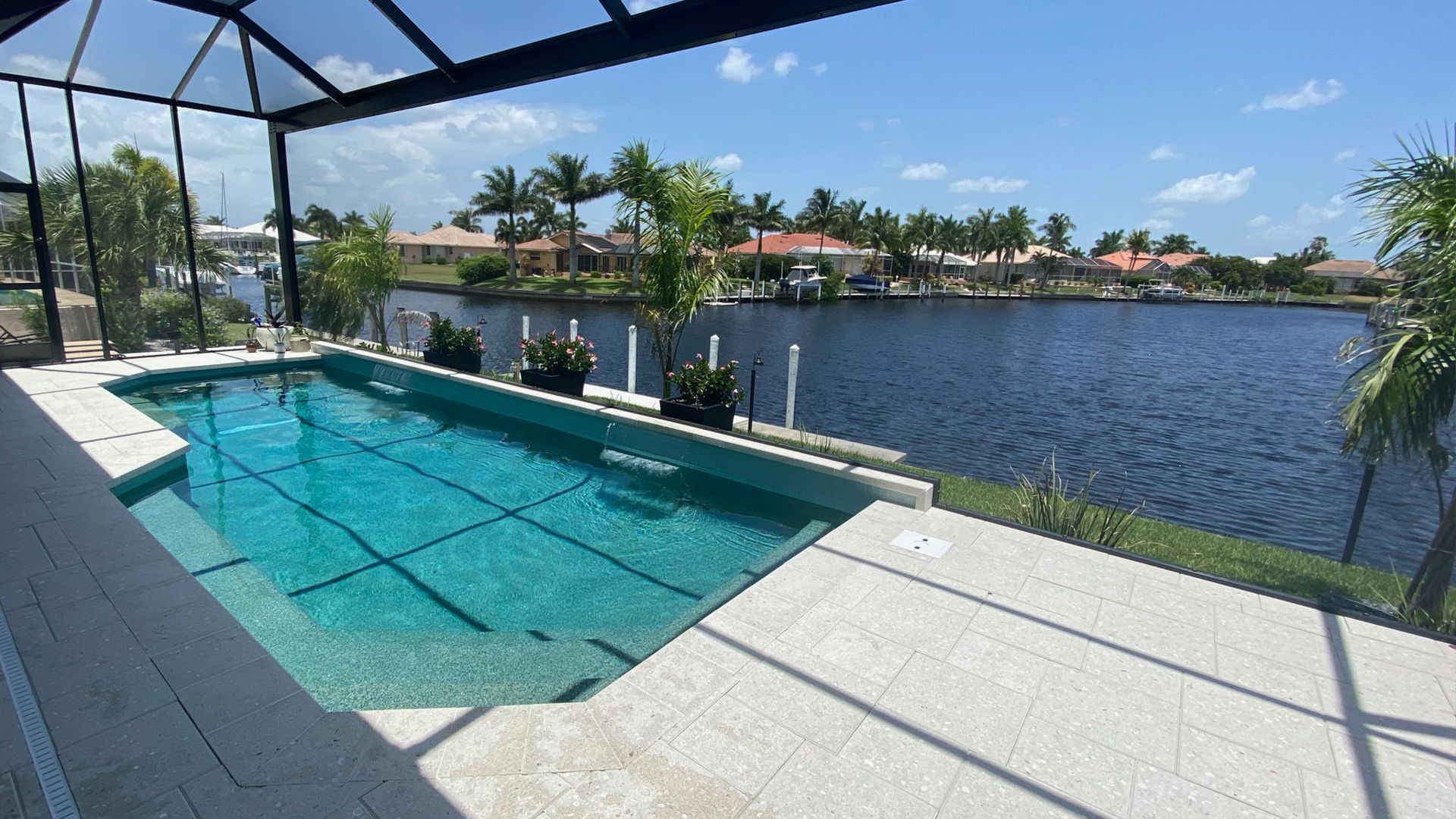 a large swimming pool with a view of a lake