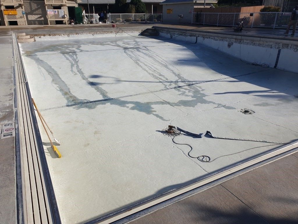 An empty swimming pool to be stripped for resurfacing