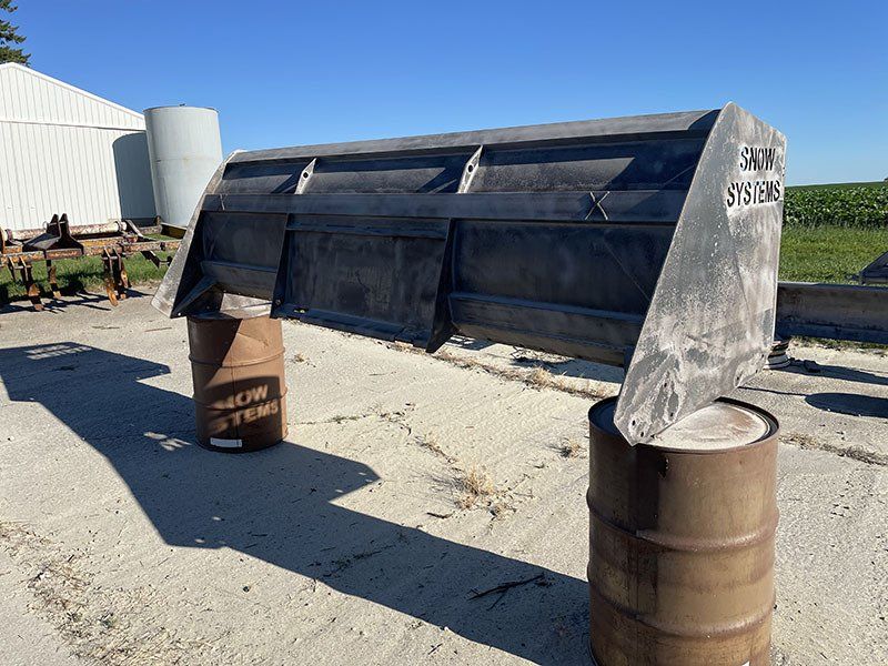 a large white tank with the number 175 on it is on a trailer