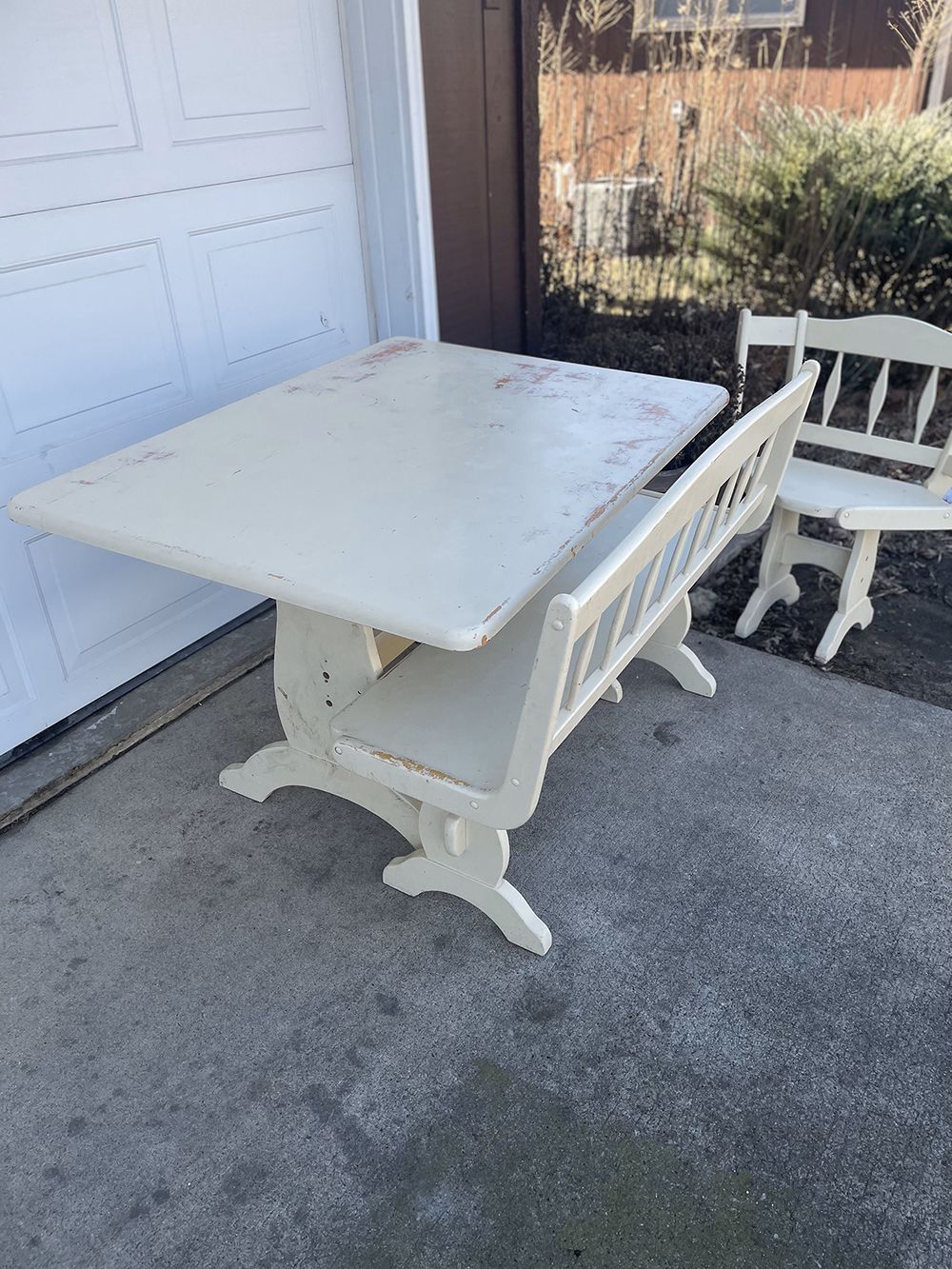 A wooden deck with a railing in front of a house