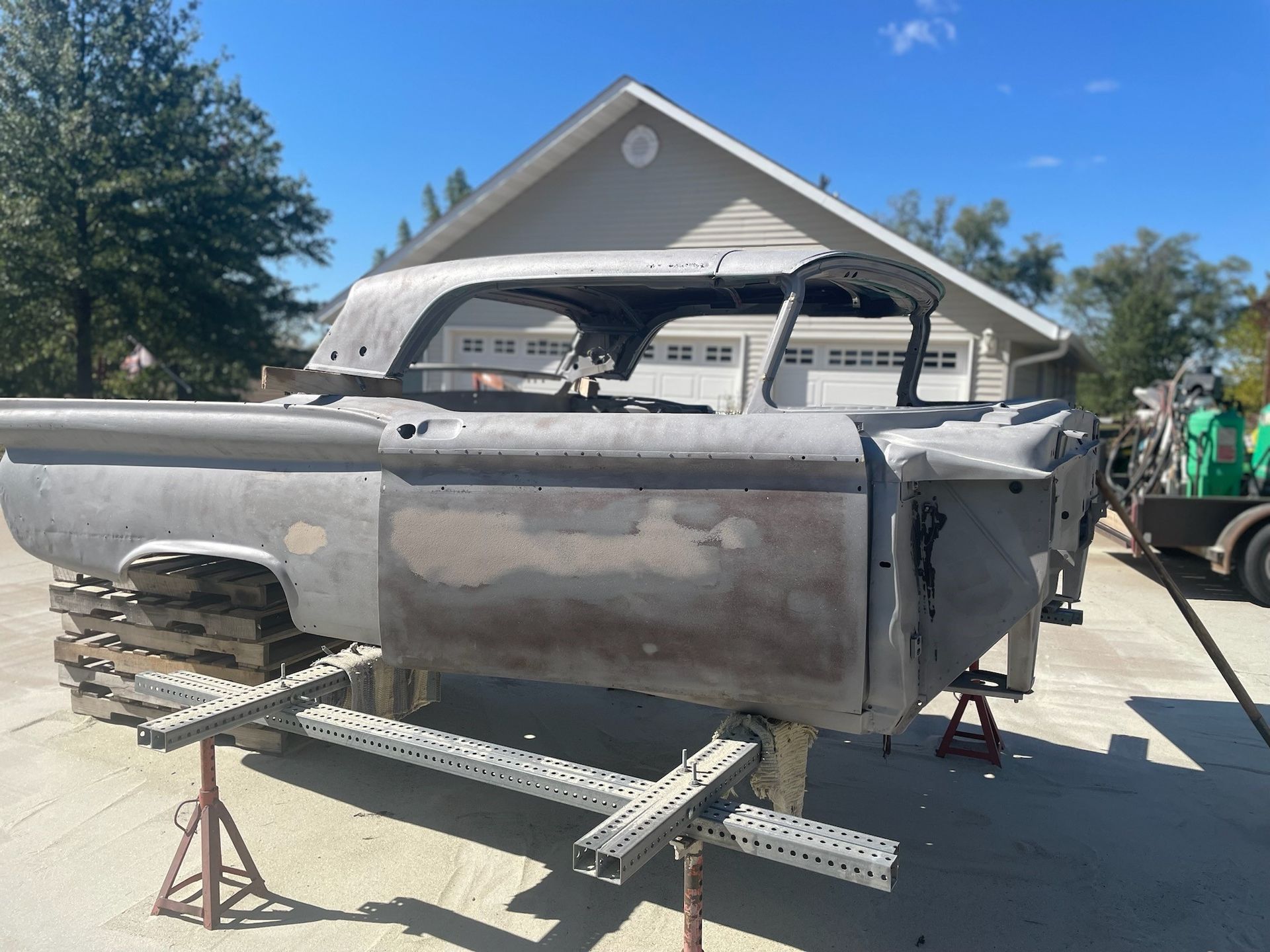 a truck is sitting in a driveway in front of a house