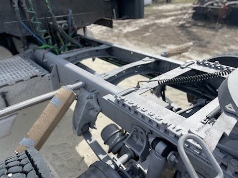 A close up of the underside of a semi truck.