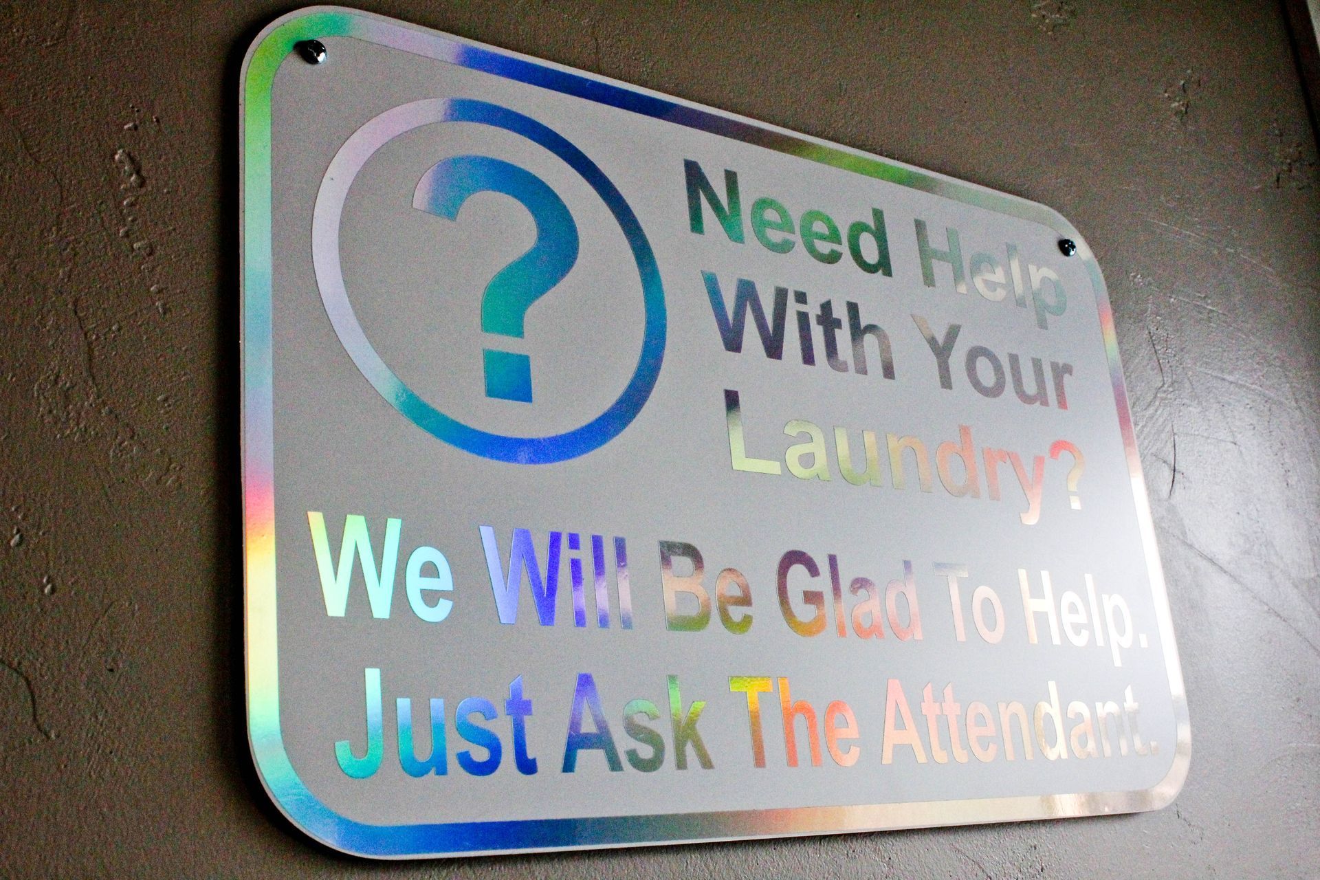 a sign that says need help with your laundry