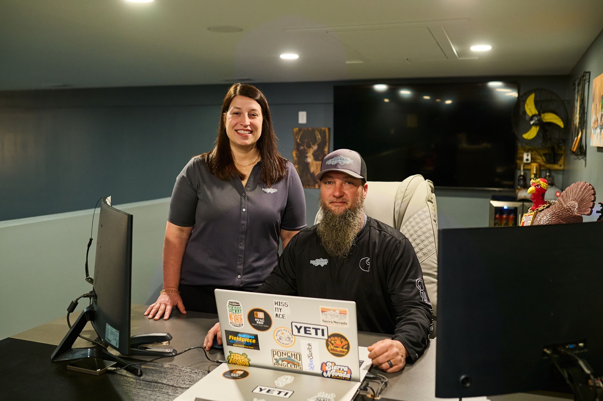 Woman and man at desks in an office.