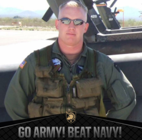 Man in military uniform, aviator glasses;