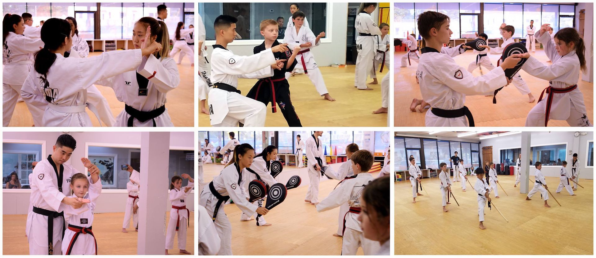 People practicing martial arts in a studio. Some are sparring, others practicing forms, wearing white uniforms and colored belts.