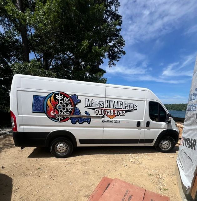 White cargo van with Massah Vacios logo parked on a dirt lot under a blue sky