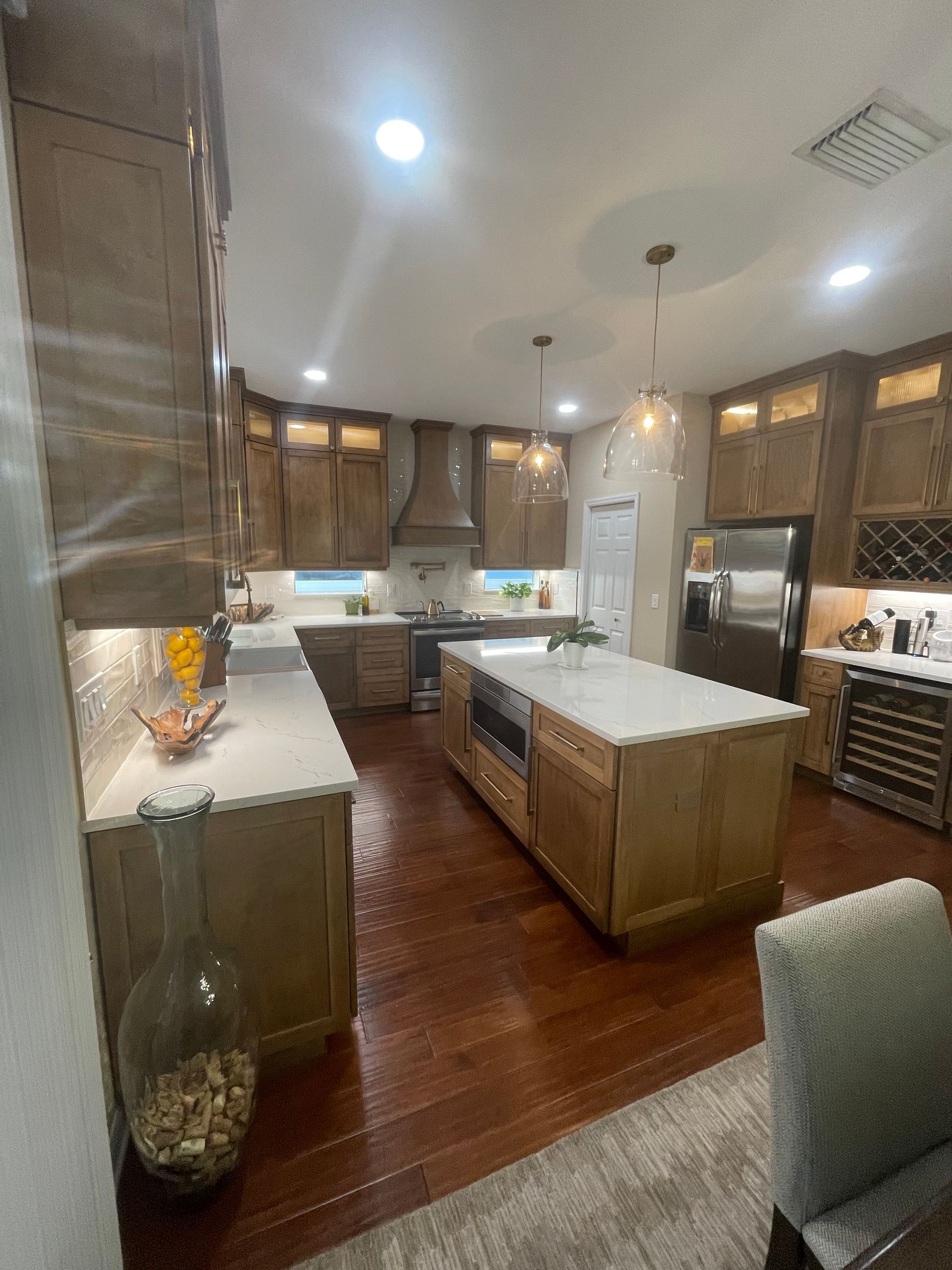 A kitchen with a large island in the middle of it.