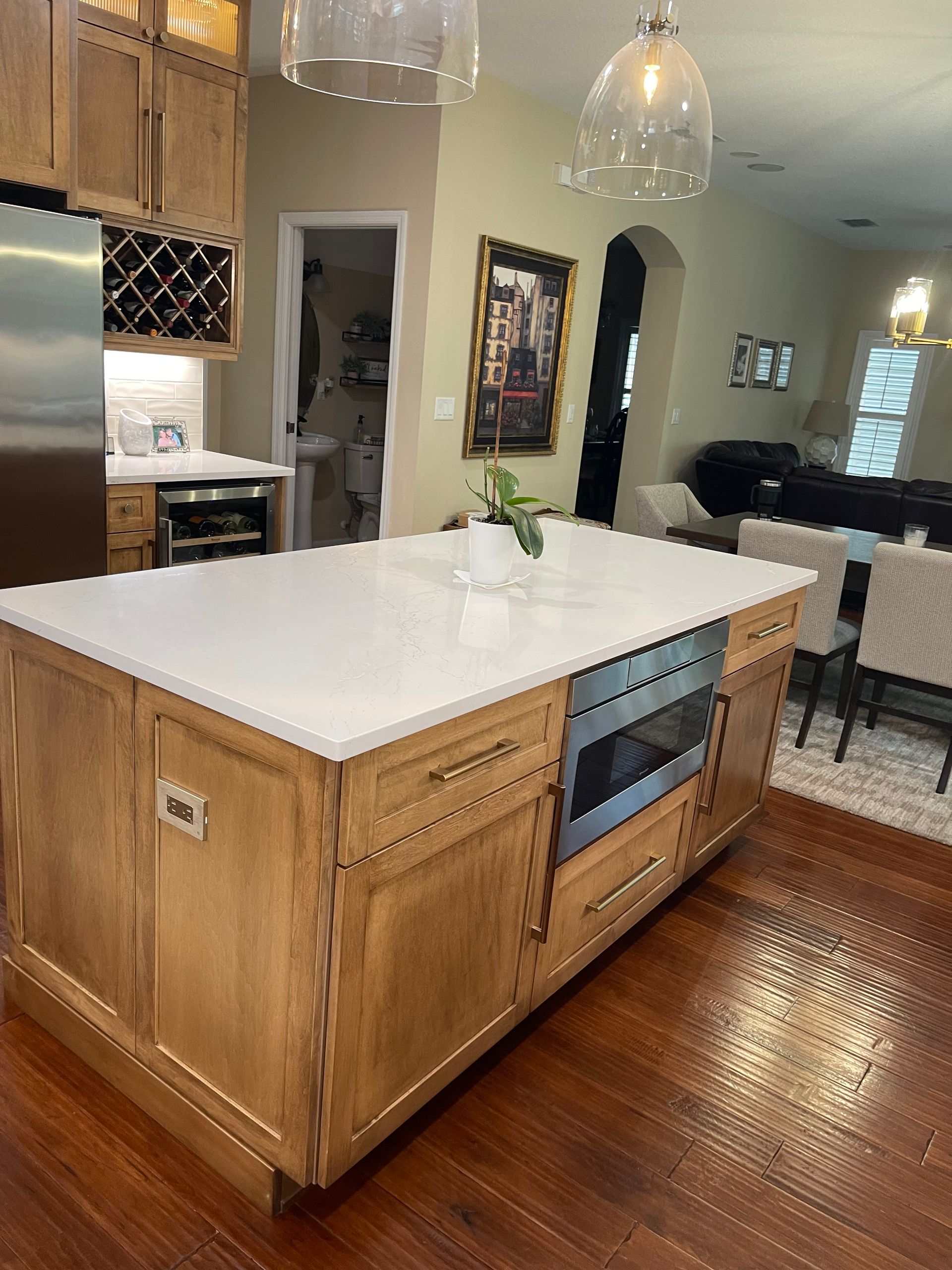 A kitchen with a large island and stainless steel appliances