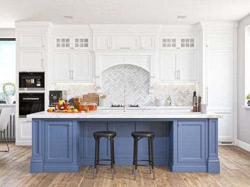 A kitchen with blue cabinets and white cabinets and a blue island.