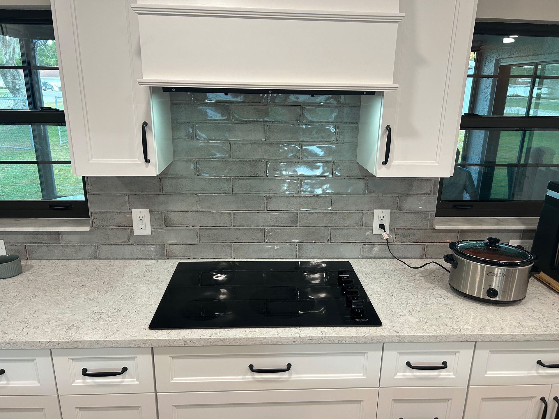 A kitchen with electric stove top