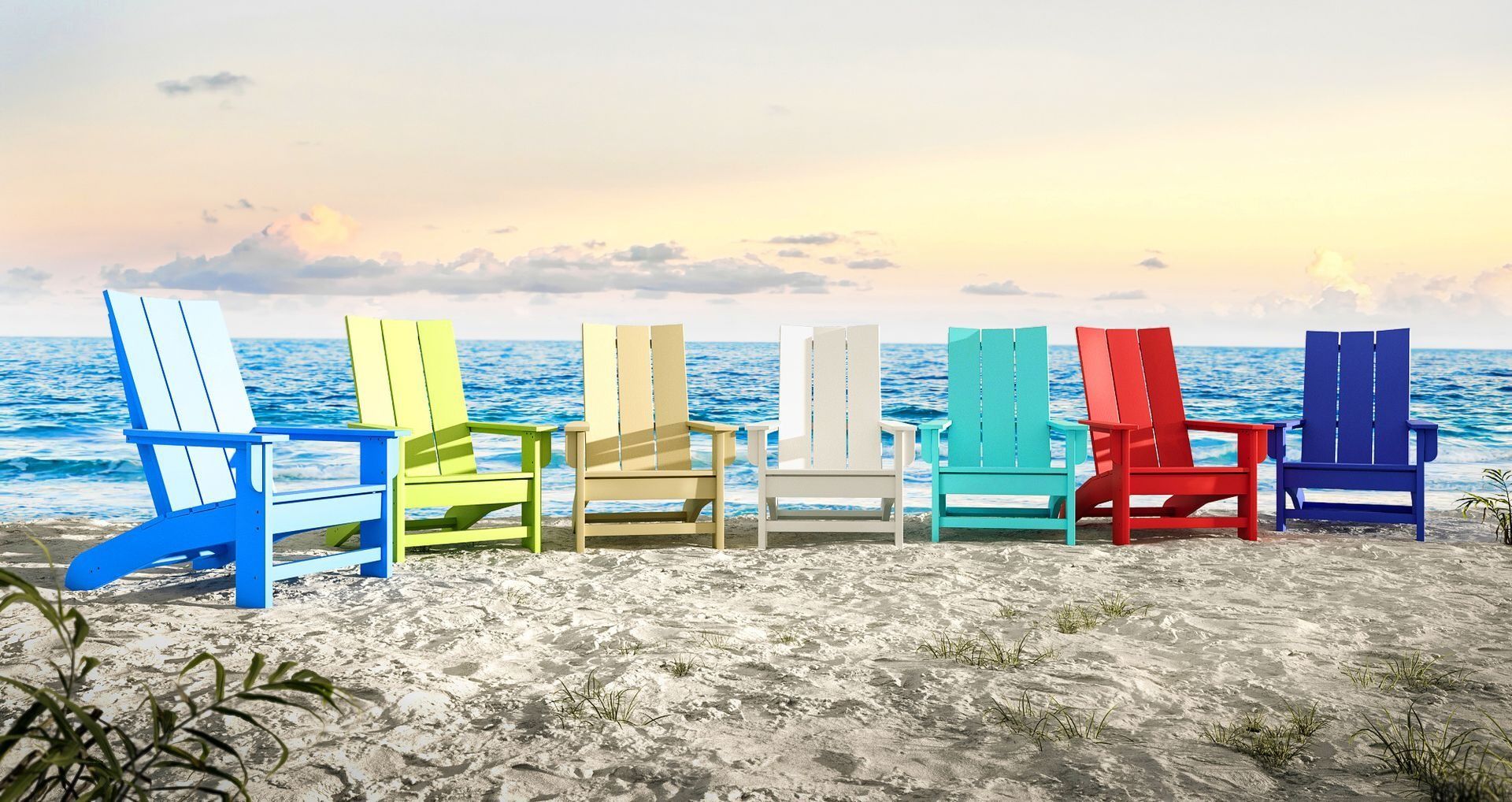 Seven colorful Adirondack chairs on a sandy beach, ocean and sky in background.