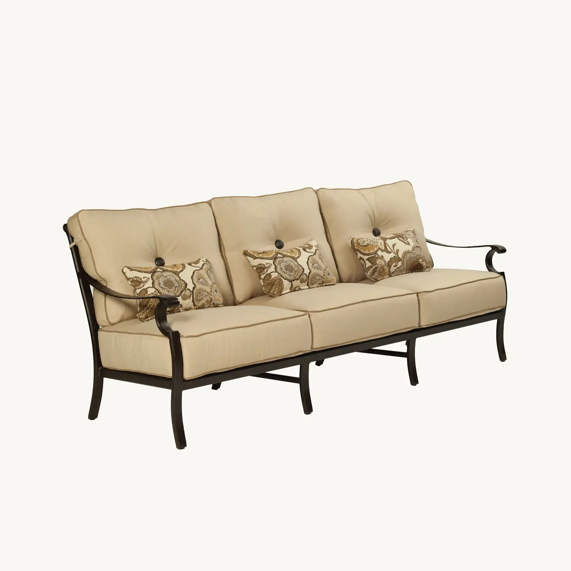 Outdoor beige sofa with black metal frame and decorative throw pillows.