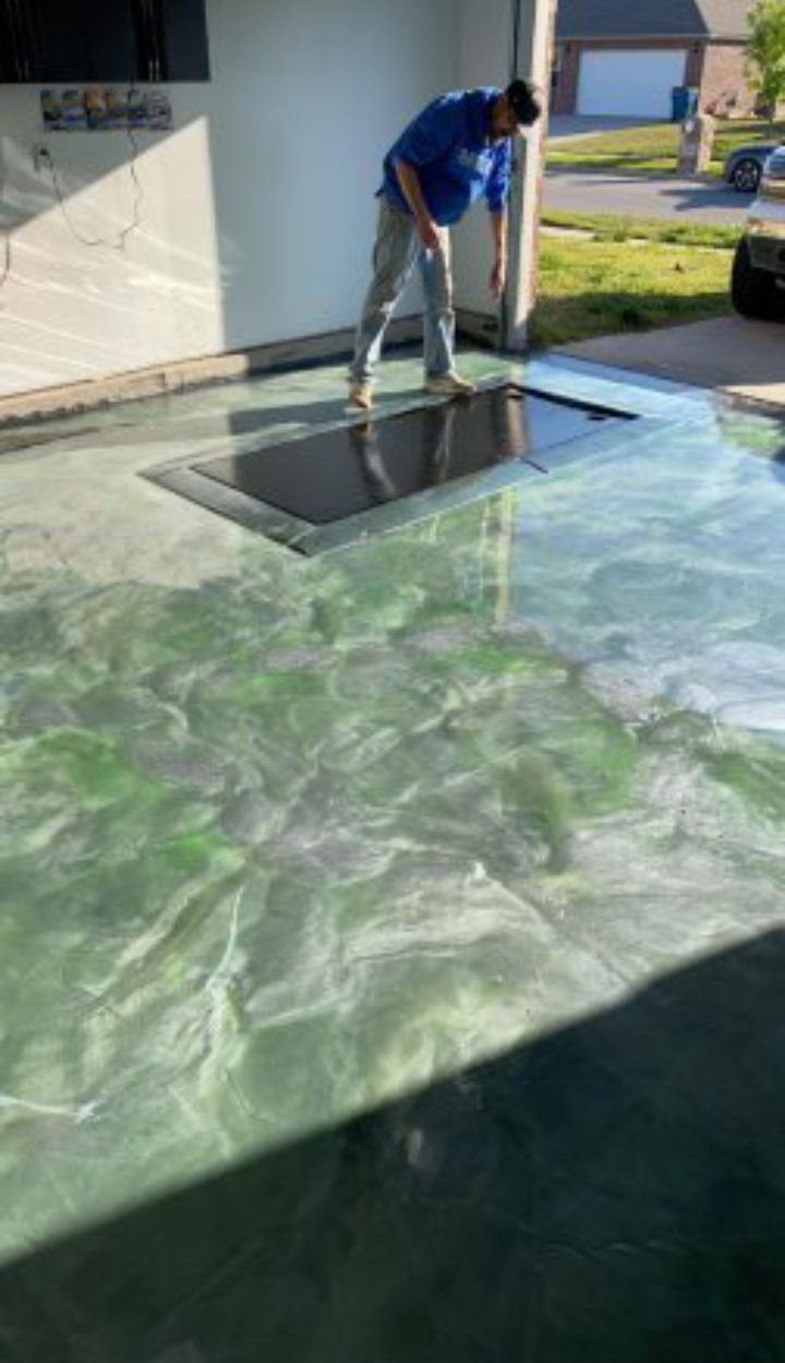 Person working on an epoxy coatings floor