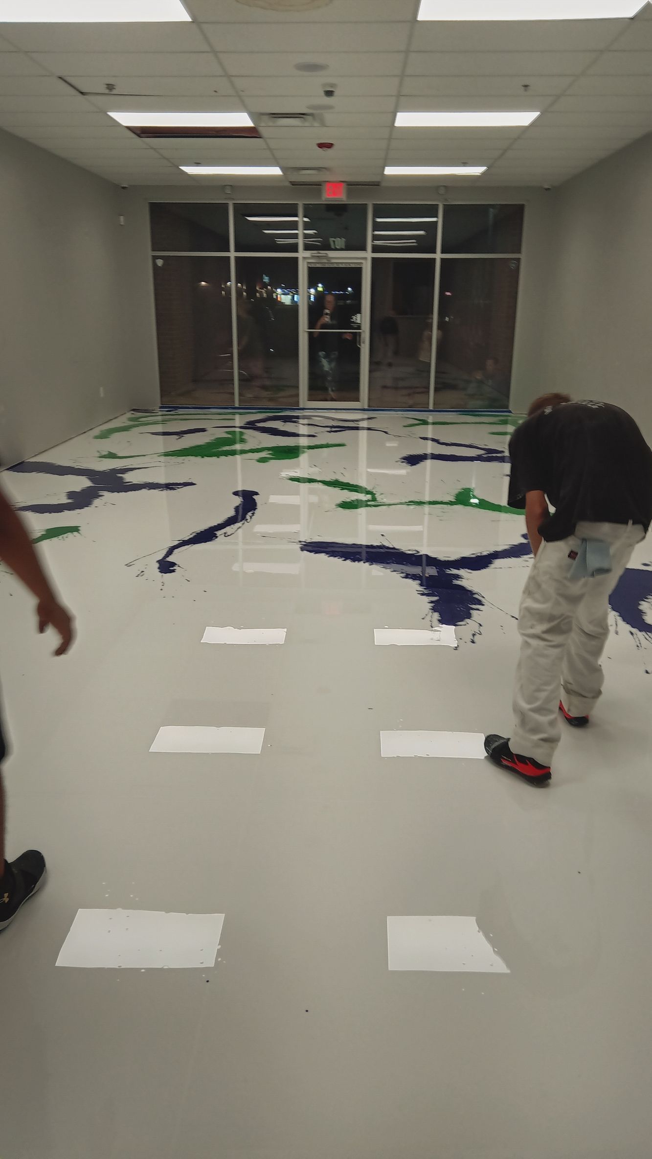 Group of people working on a floor epoxy coatings