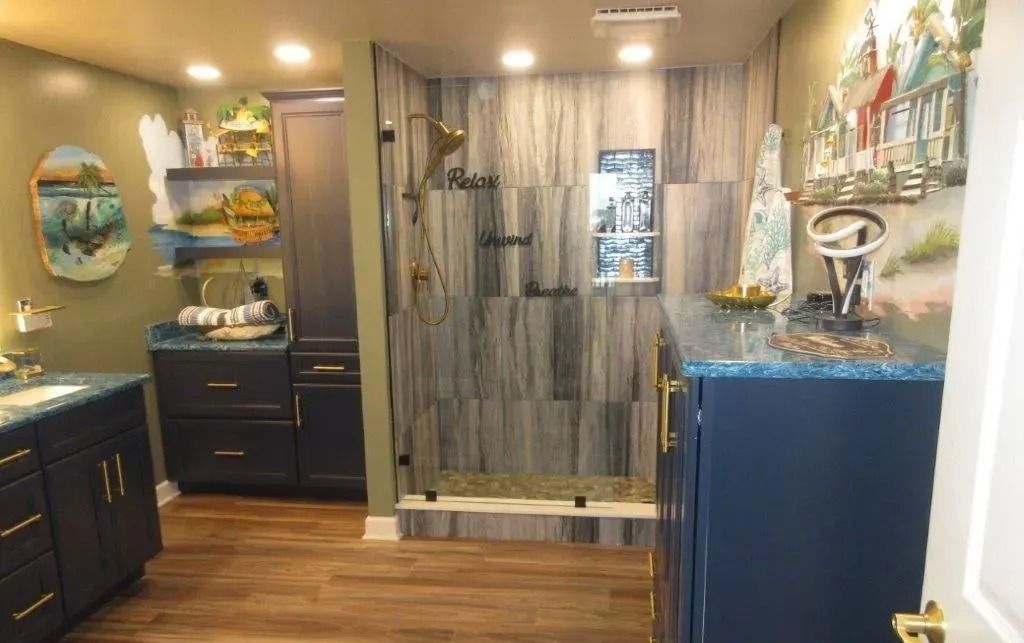 Cozy salon waiting area with dark cabinets, blue decor, wood floor, and a rustic barn-style door