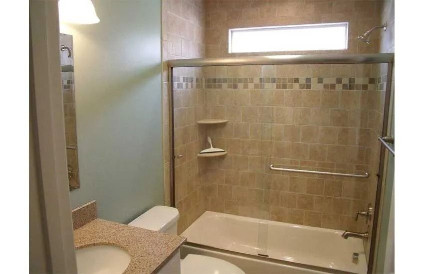 Accessible bathroom with walk-in tub, grab bar, and beige tile shower area