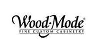 Wood-Mode Fine Custom Cabinetry logo in black script on a white background