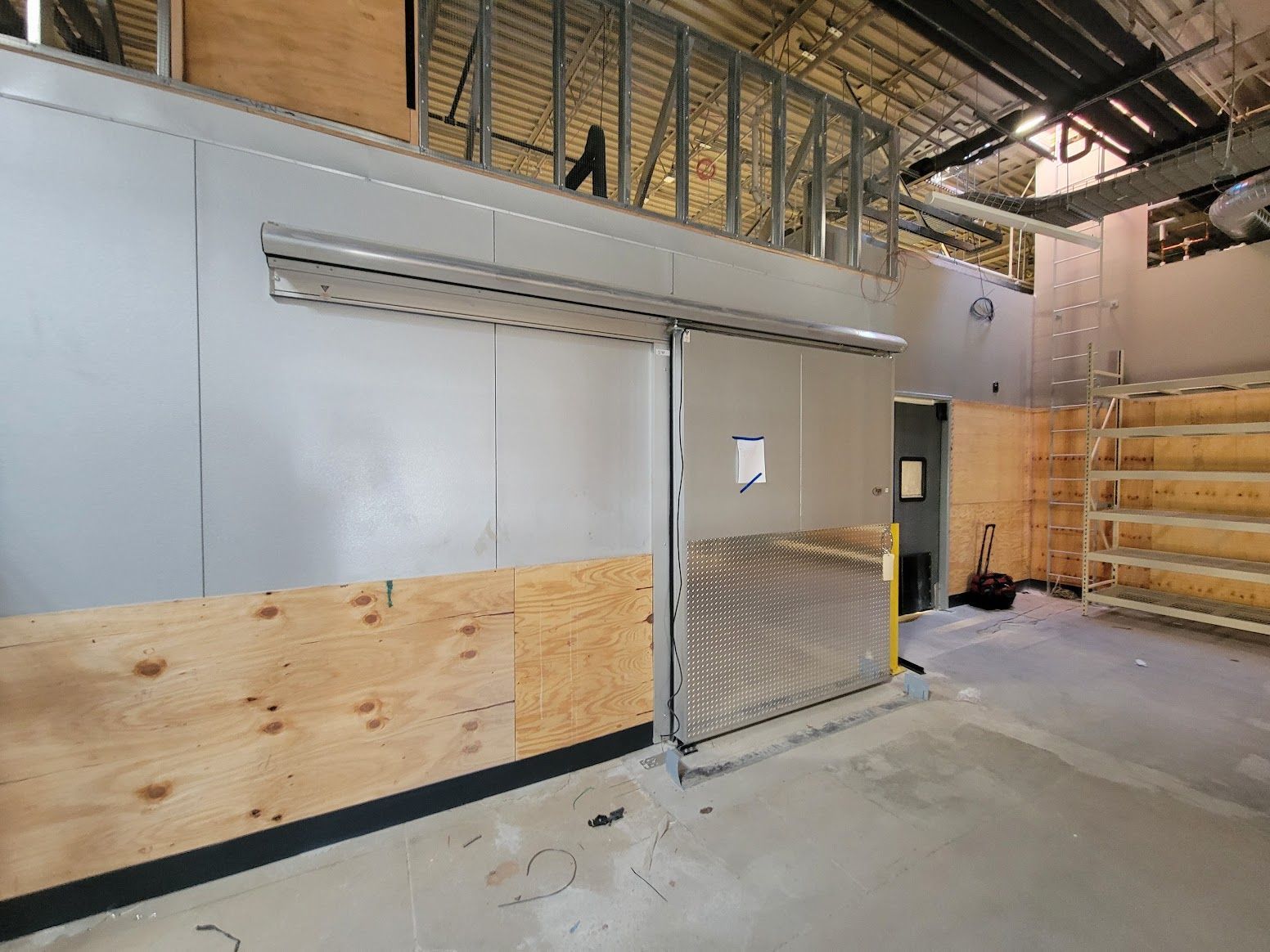 There is a sliding door in the middle of the room.