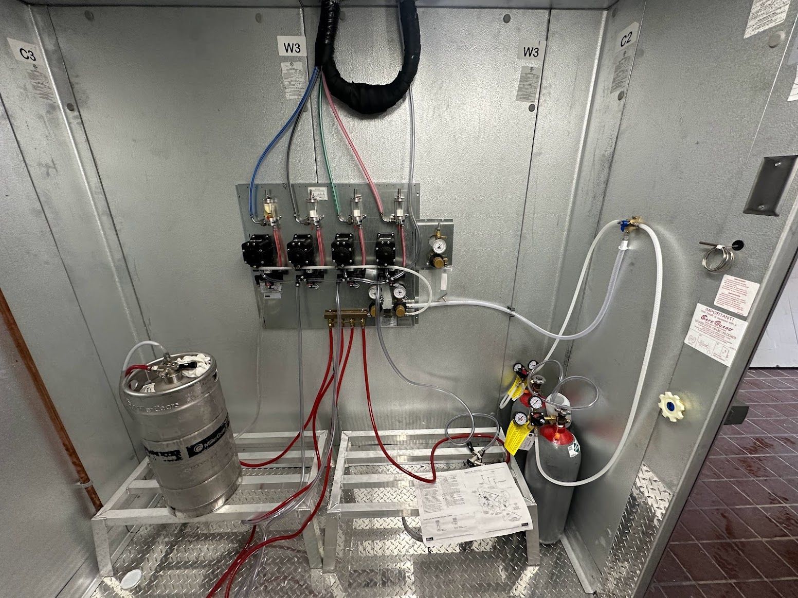 A metal box with a bunch of wires coming out of it.