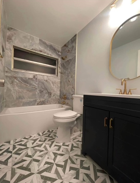 A bathroom with a black cabinet