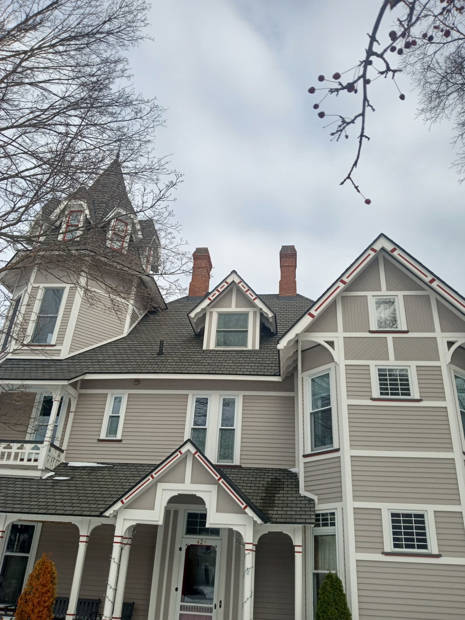 A large house with a tower on top of it.