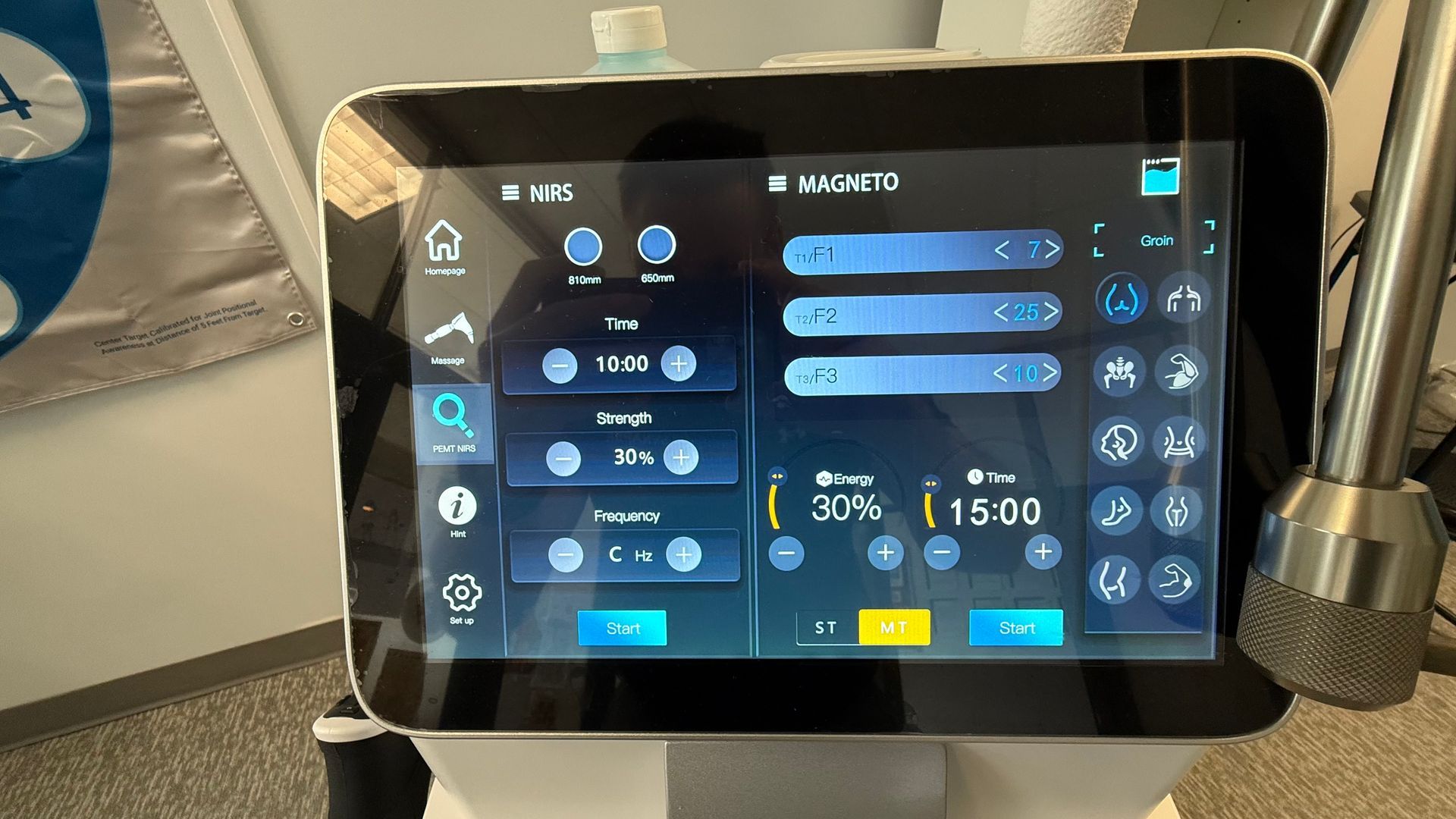 Touchscreen interface displaying settings for a medical device. Blue and white interface, with various settings and a timer.