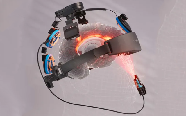 A virtual reality headset with a red light coming out of it.