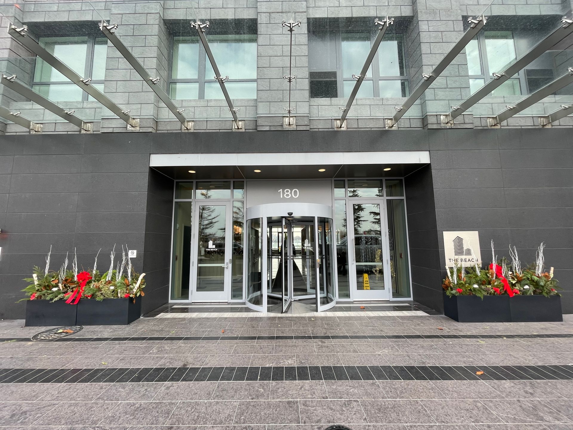 A large building with a glass canopy over the entrance.