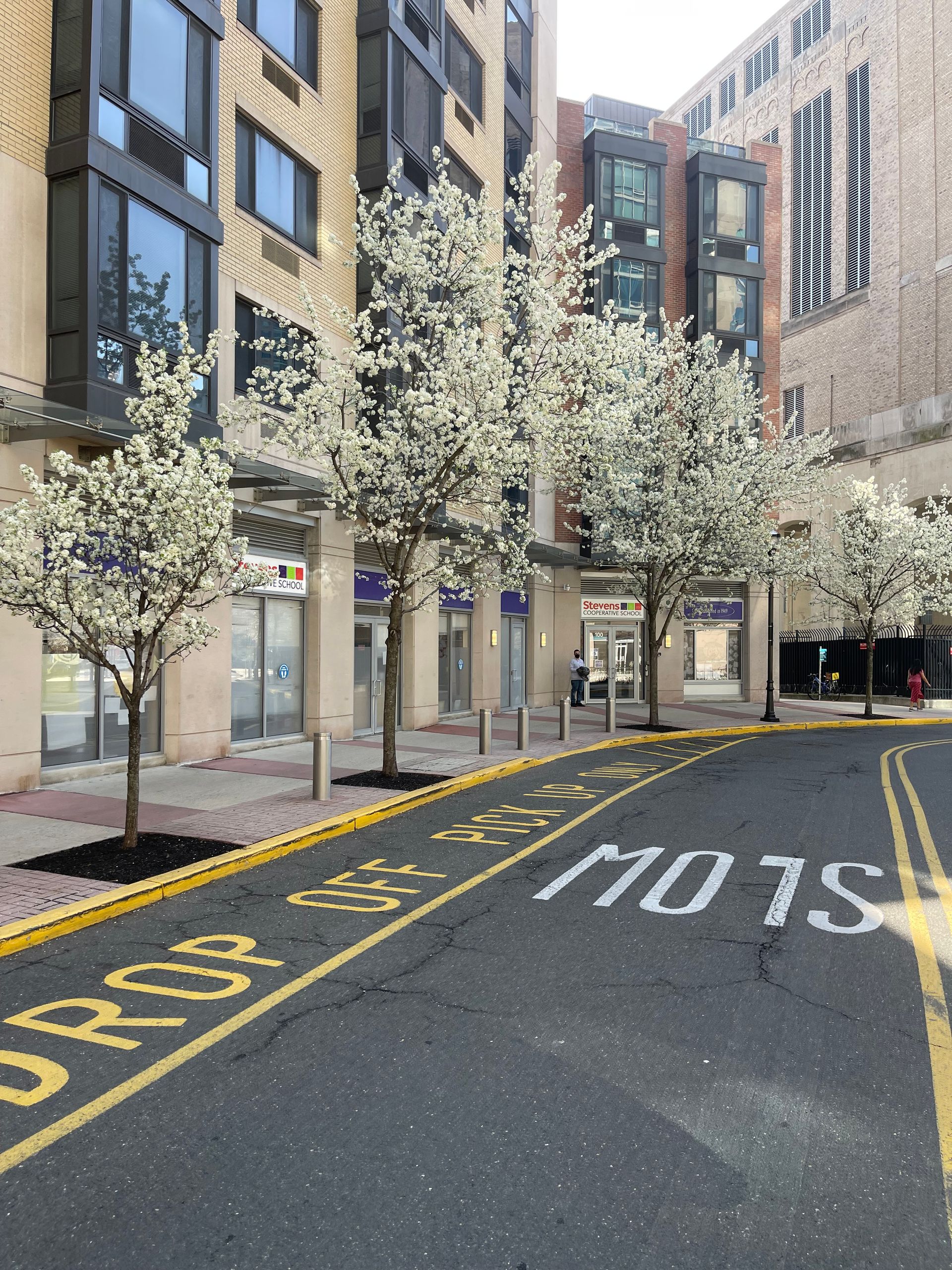 A street with a sign that says slow on it