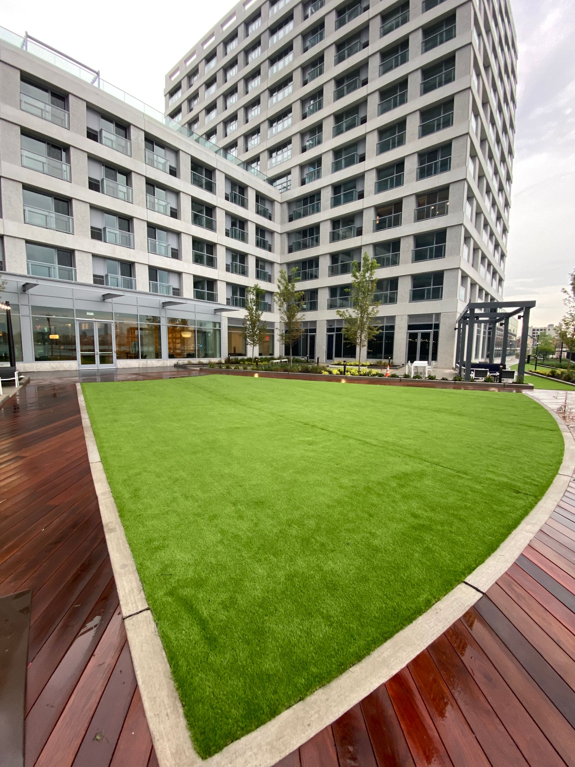 A large building with a large lawn in front of it.