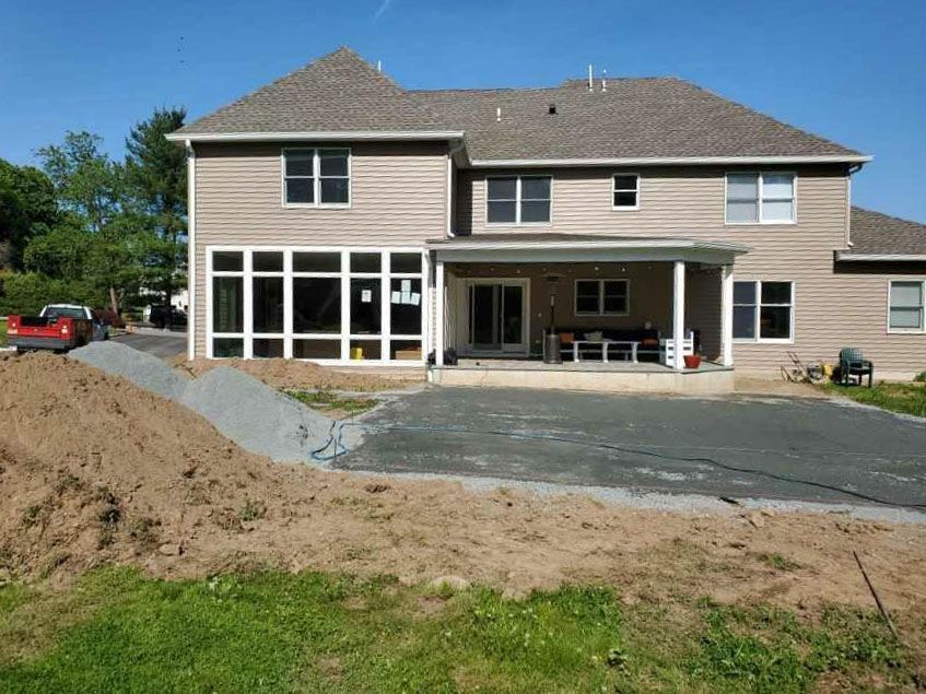 A large house with a lot of windows is being built