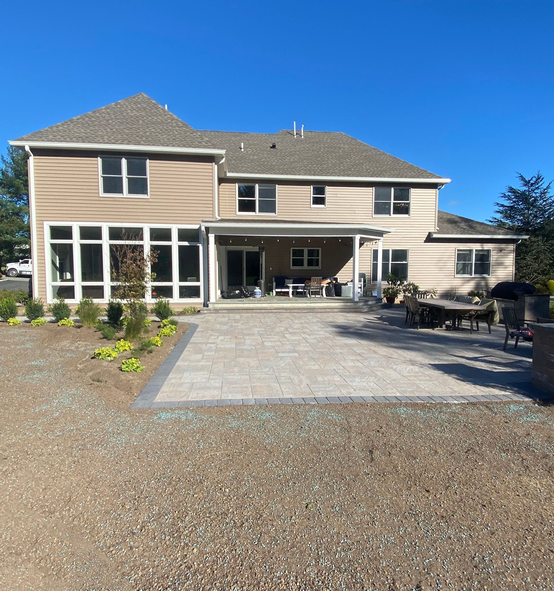 A large house with a driveway leading to it