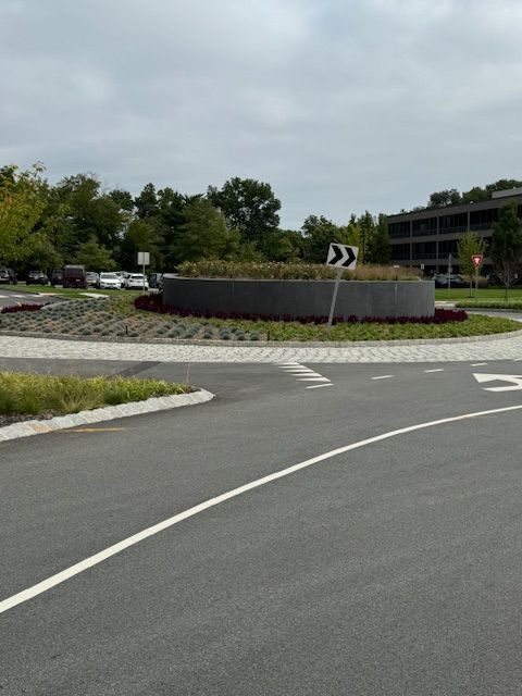 A roundabout with an arrow pointing to the right
