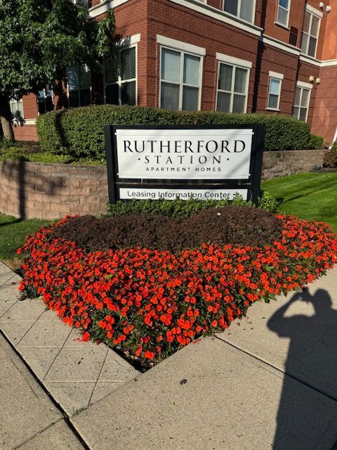A sign that says rutherford station on it