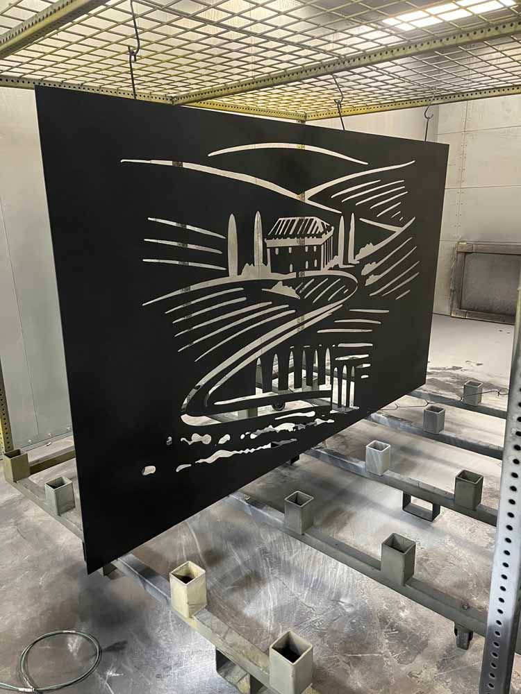 A large piece of metal is sitting on top of a shelf in a room.