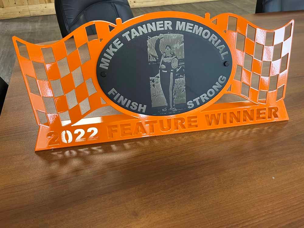 A sign that says mike tanner memorial on it