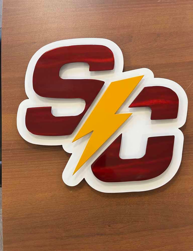 A red and white logo with a yellow lightning bolt