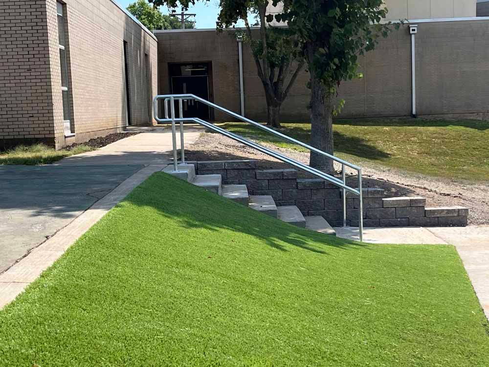 A set of stairs leading up to a building with a railing.