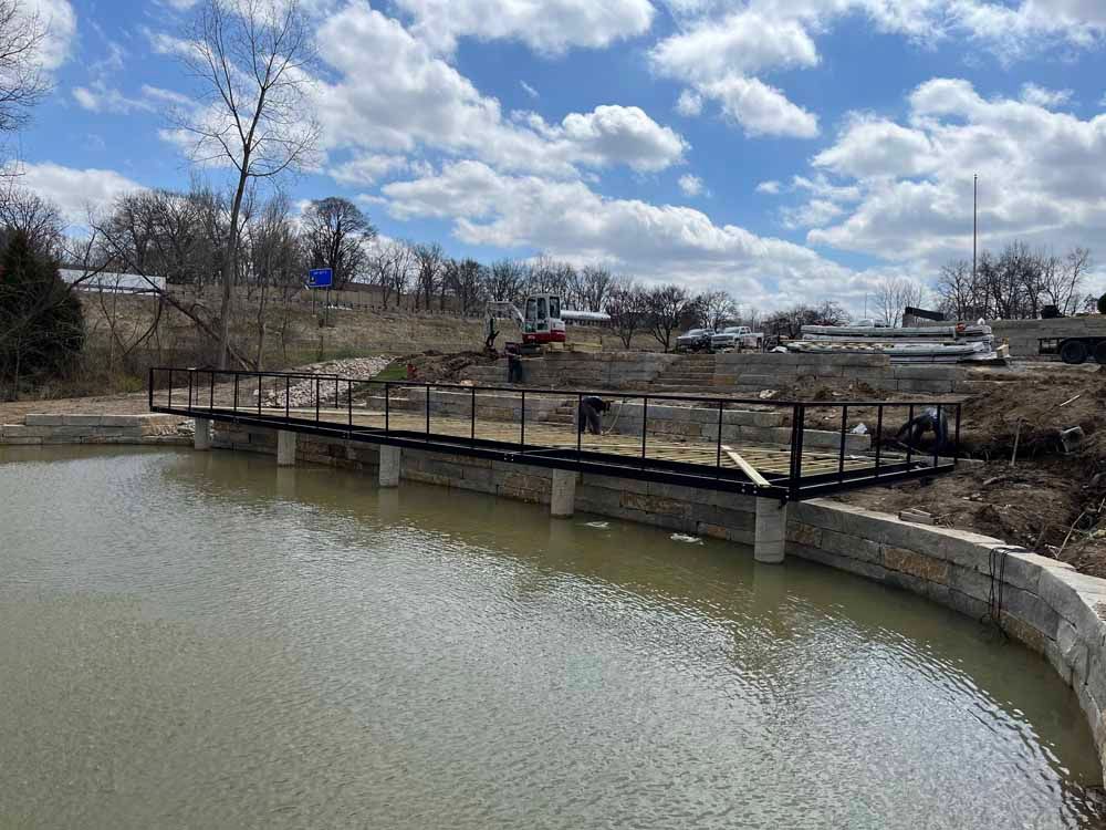A bridge is being built over a body of water.