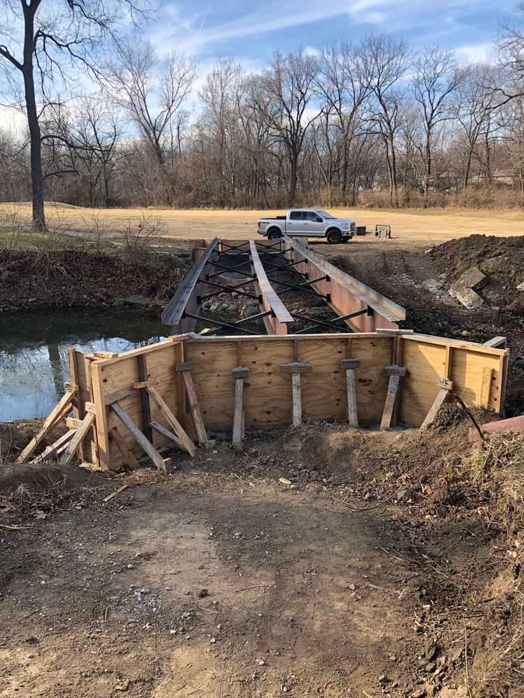 A bridge is being built over a body of water.