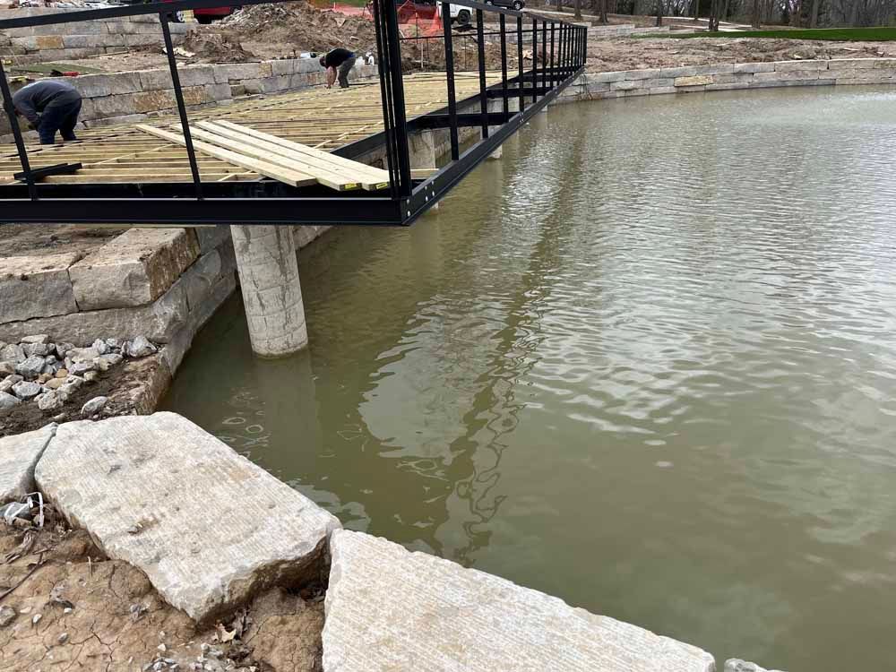 A bridge is being built over a body of water.