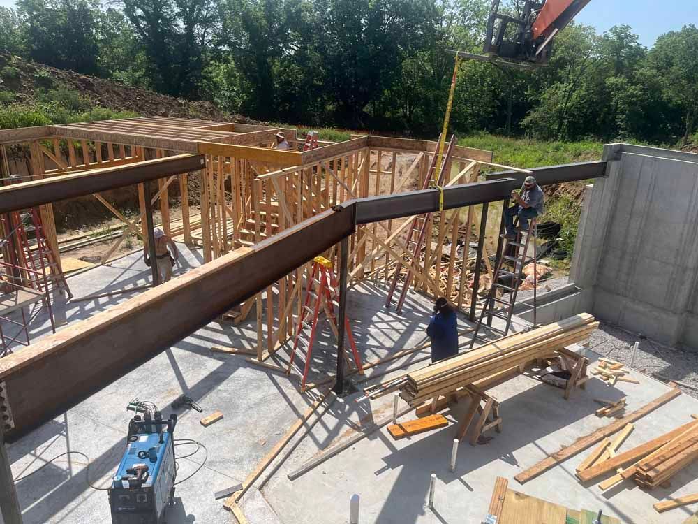 A group of construction workers are working on a building under construction.
